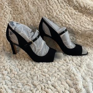 Black peep toe Mary Jane style shoes in black suede.